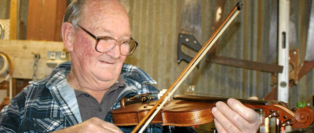 Ken Mitchell puts his handmade violin to work. Ken Mitchell puts his handmade violin to work.